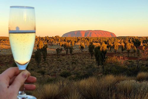 Raising a glass to Ayers Rock at sunset