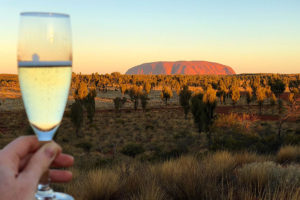 Raising a glass to Ayers Rock at sunset