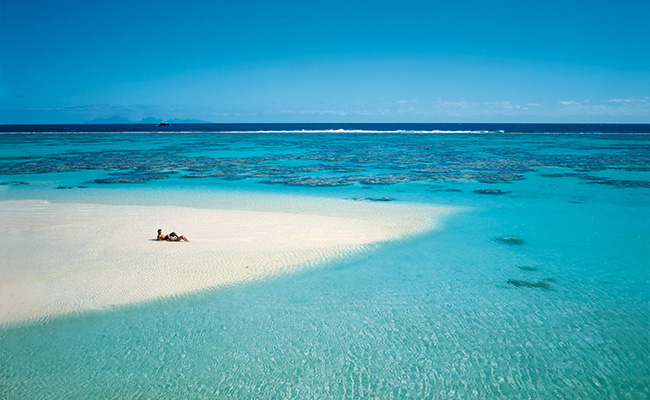 Couple on a Private Beach at The Brando Resort on Tetiroa Island, French Polynesia