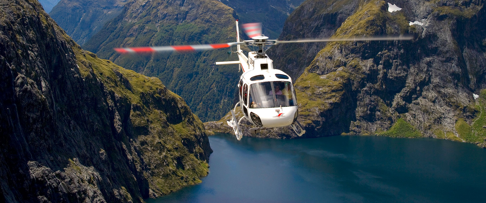 Indulgent Escape: New Zealand Luxury Vacation - Helicopter Over Milford Sound