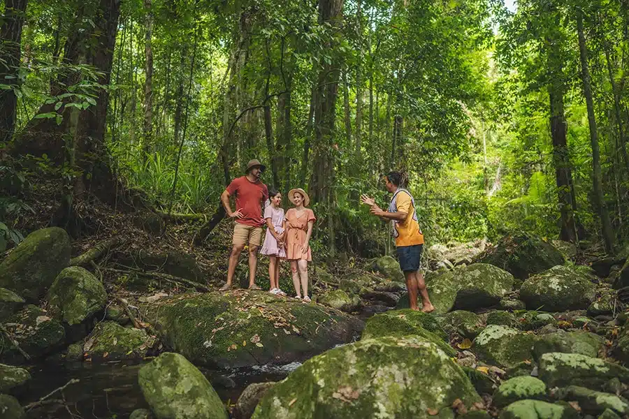 Family relaxing at Mossman Gorge - Walkabout Cultural Adventures - Daintree Rainforest, Australia